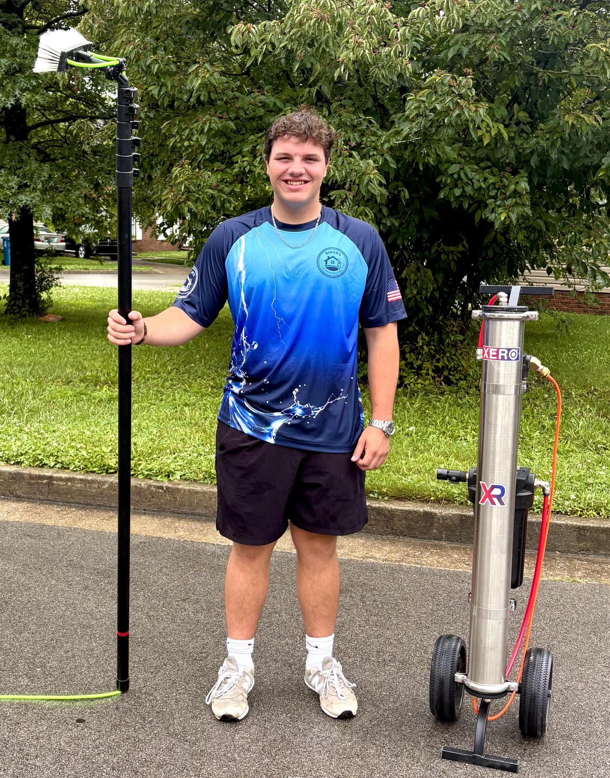 Zack Baker with professional exterior window cleaning equipment